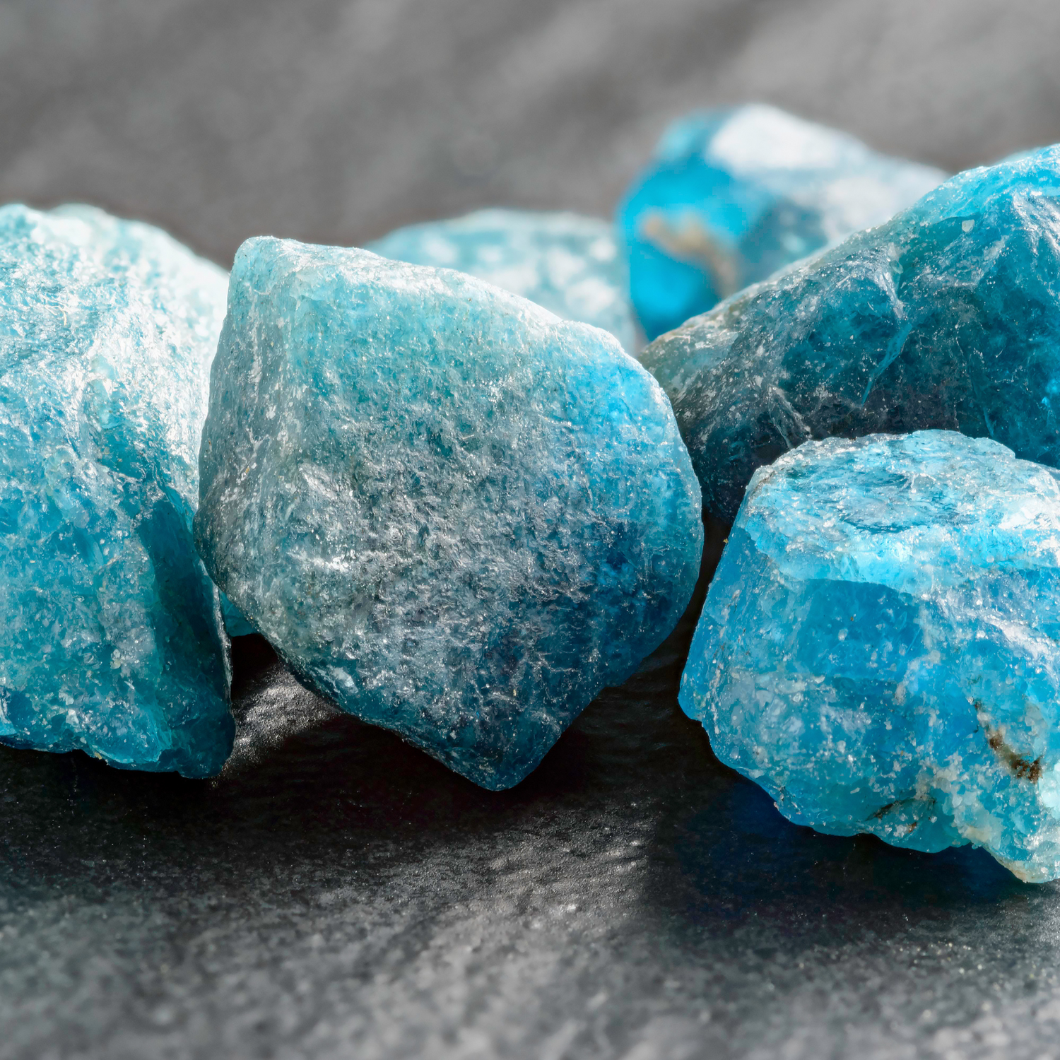 Close-up of vibrant blue apatite crystals for sale highlighting their natural clarity and texture