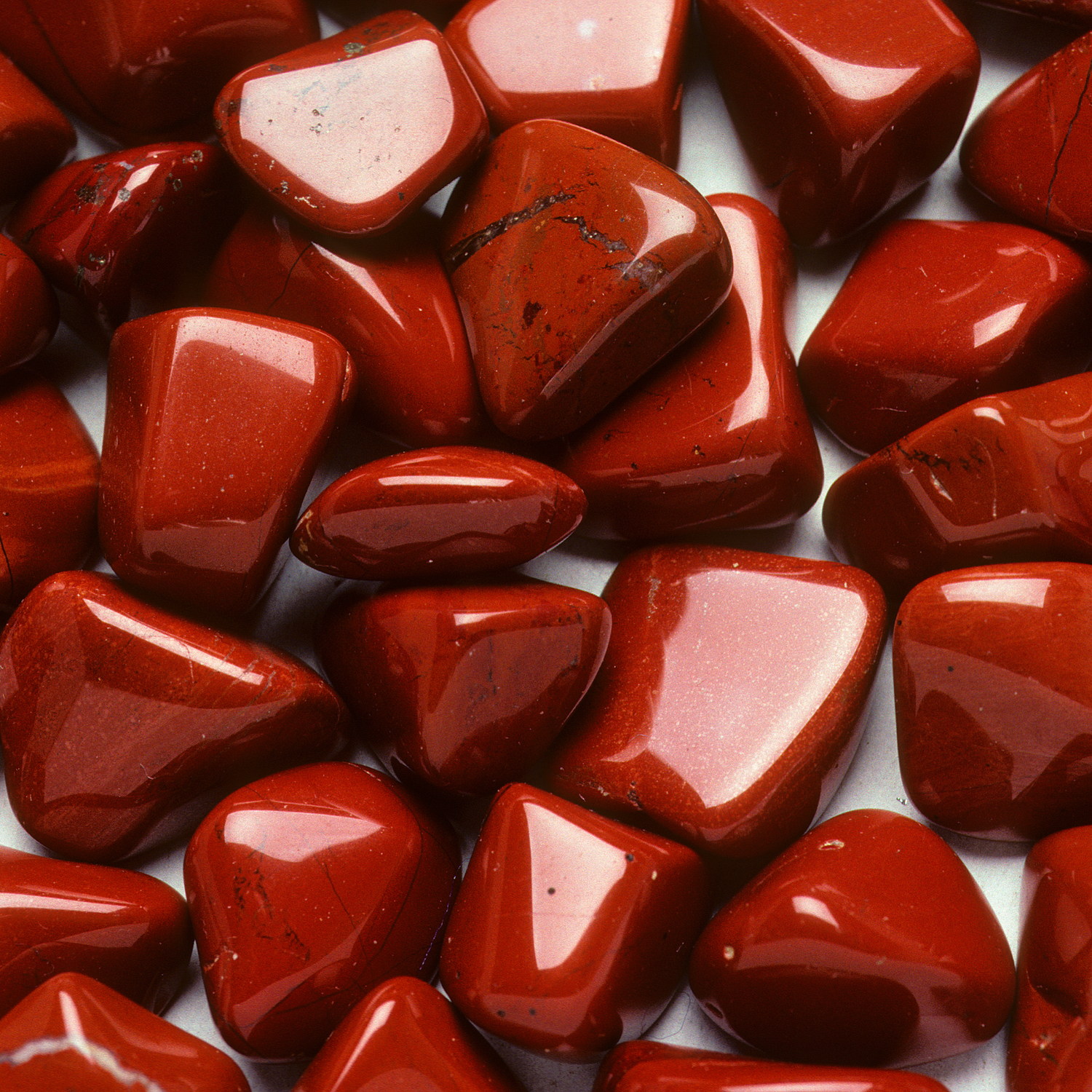 Smooth polished red jasper stones showcasing grounding energy available to buy Jasper stones online