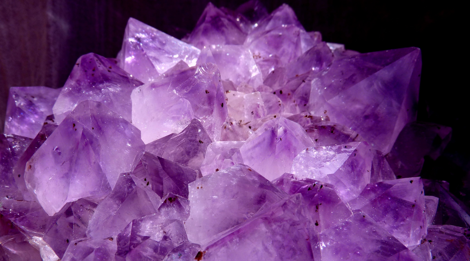 purple amethyst natural formation cluster with black background