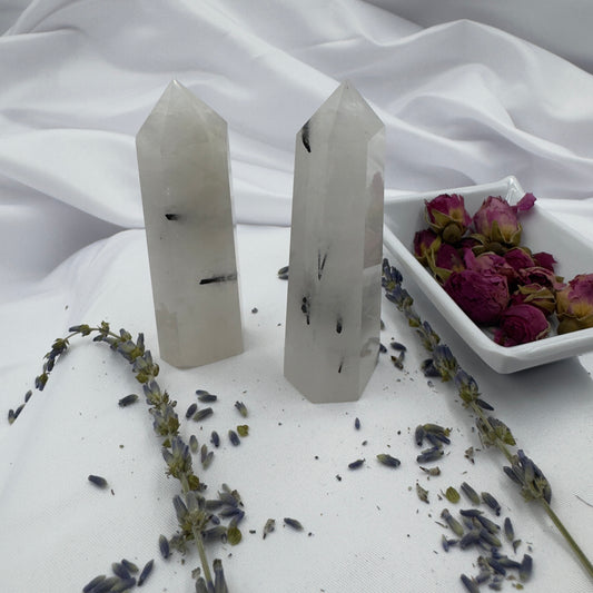 Davinas clear crystal towers with black tourmaline inclusions displayed with dried lavender and rose petals