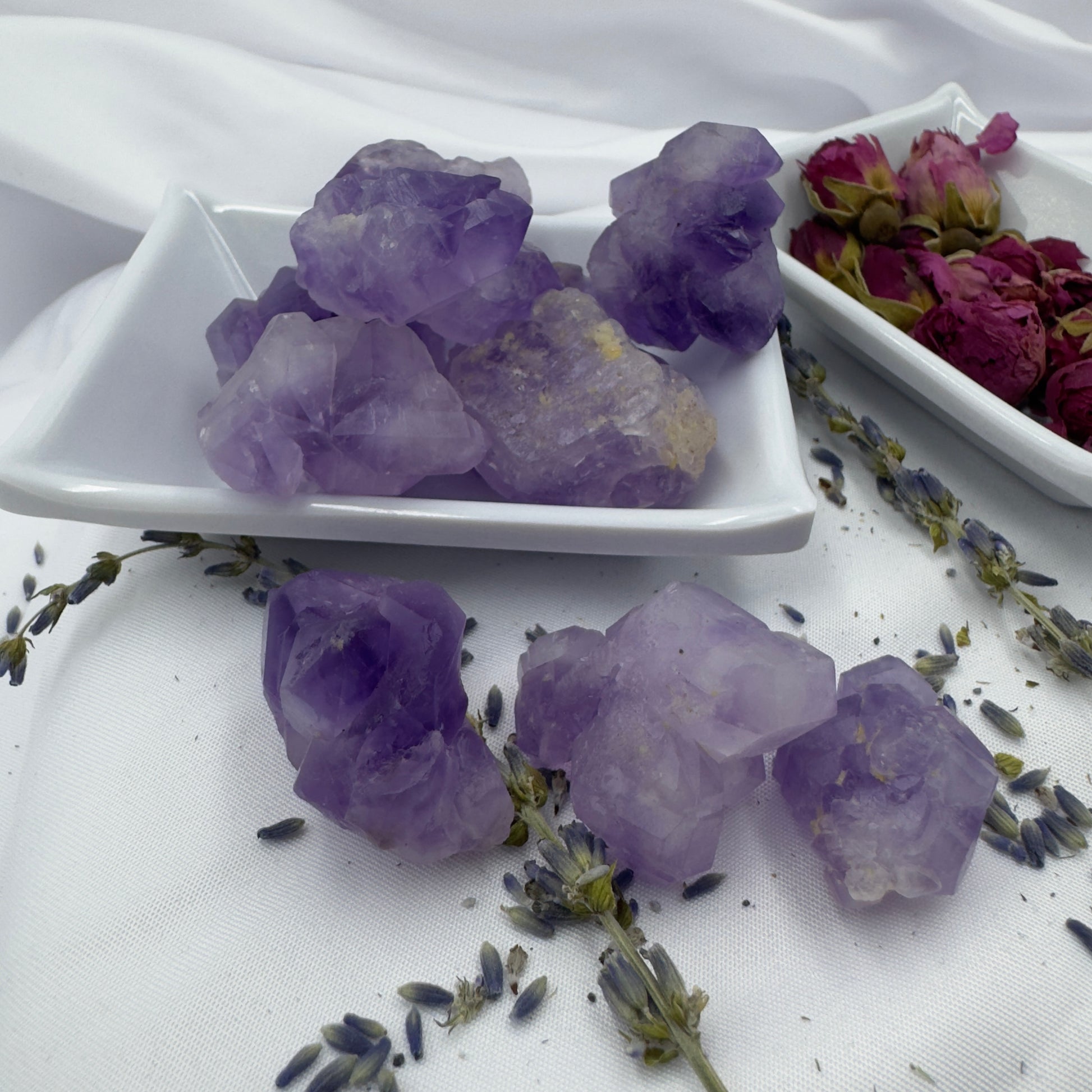 Buy amethyst mini clusters displayed on white ceramic dishes with dried flowers and lavender sprigs