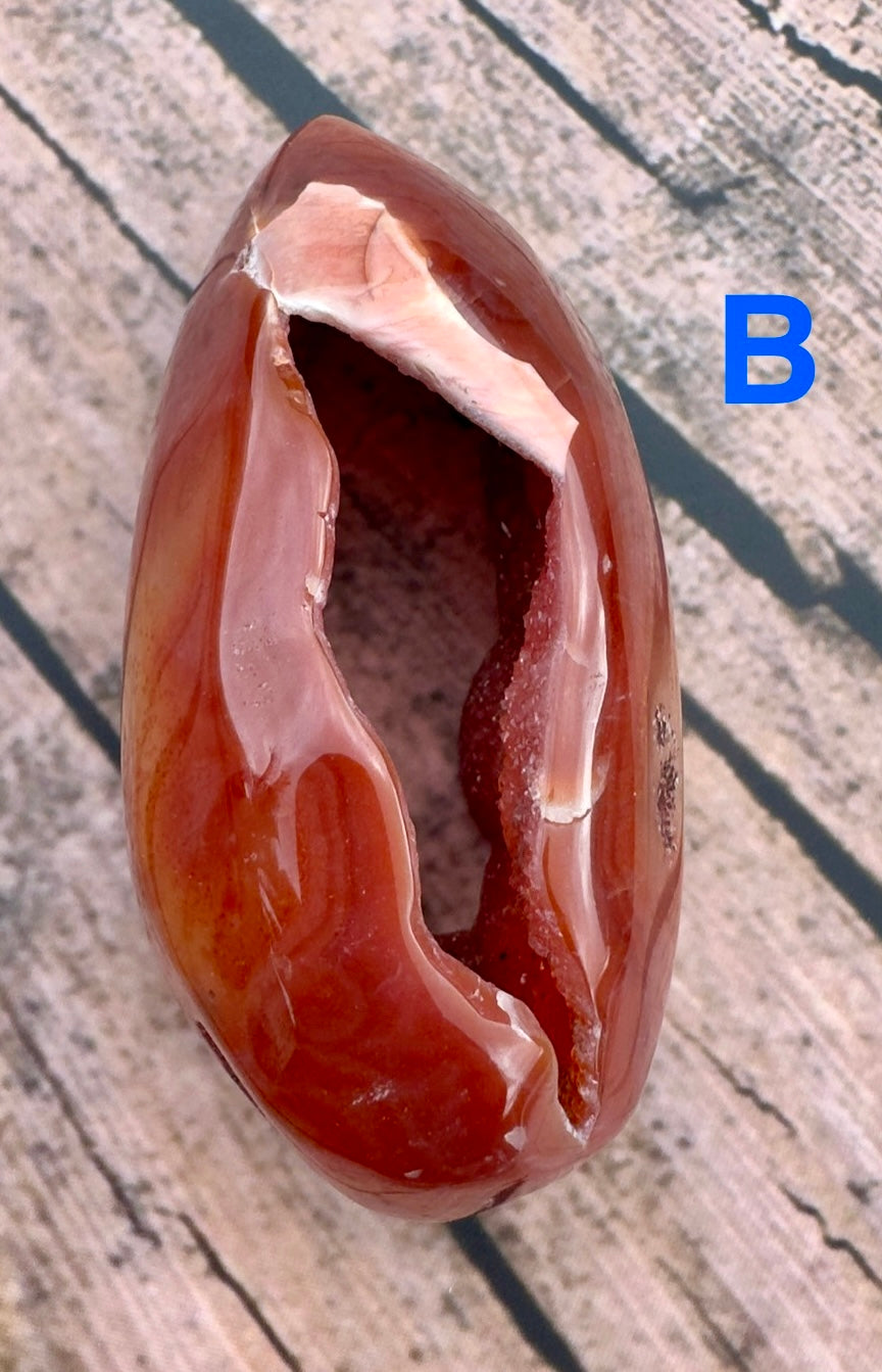 Davinas Carnelian Geode Druzy Freeform with polished deep orange exterior and sparkling crystal interior