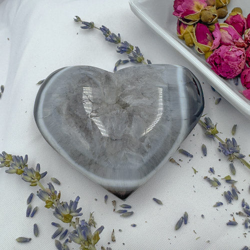 Heart-shaped gray crystal on white fabric with dried flowers premium crystal gifts Davinas