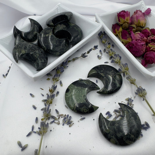Davinas Kambaba Jasper Moon stone crescent shapes displayed with dried lavender and rose buds