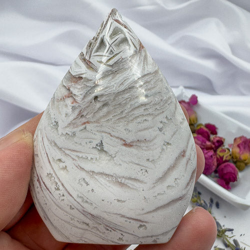 Davinas Morocco agate freeform stone with natural white and gray patterns held in hand