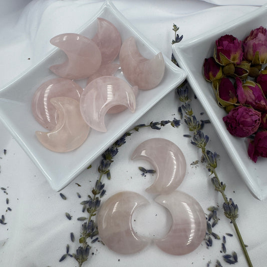 Davinas rose quartz moon crystal crescent-shaped stones displayed with dried lavender and rose buds
