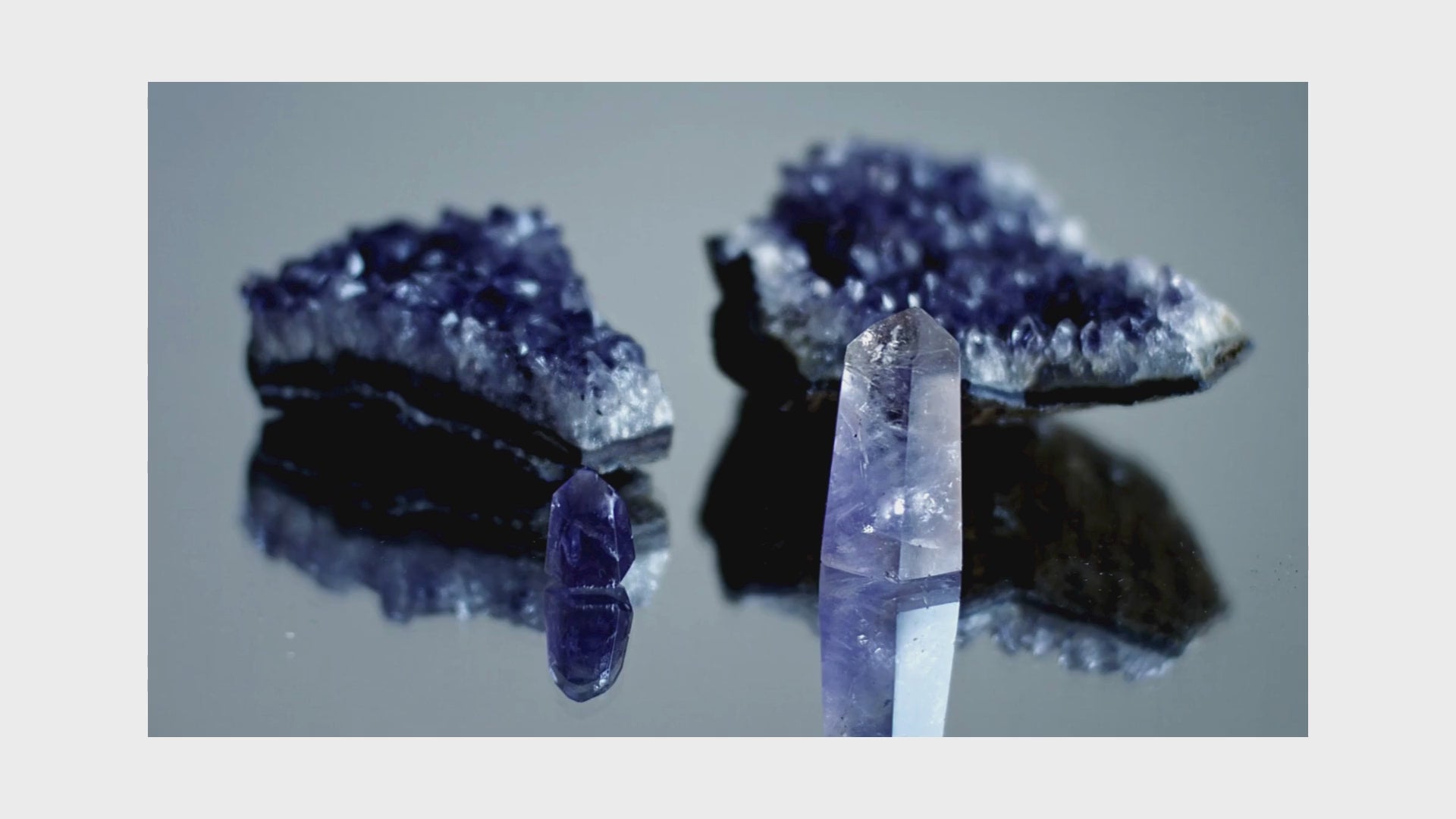 Load video: looped video showing amethyst clear quartz natural crystals on turn table