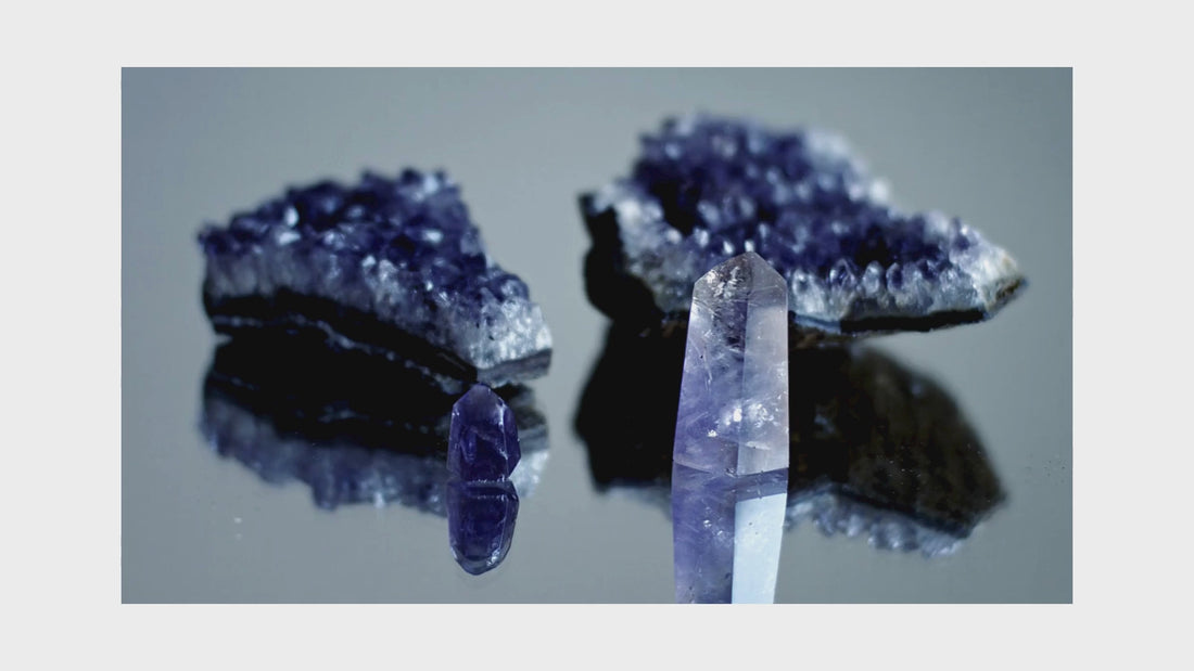 looped video showing amethyst clear quartz natural crystals on turn table